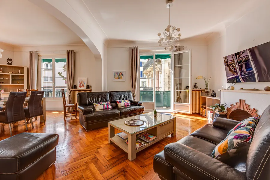 Spacious living room with balcony in the apartment for sale in central Biarritz